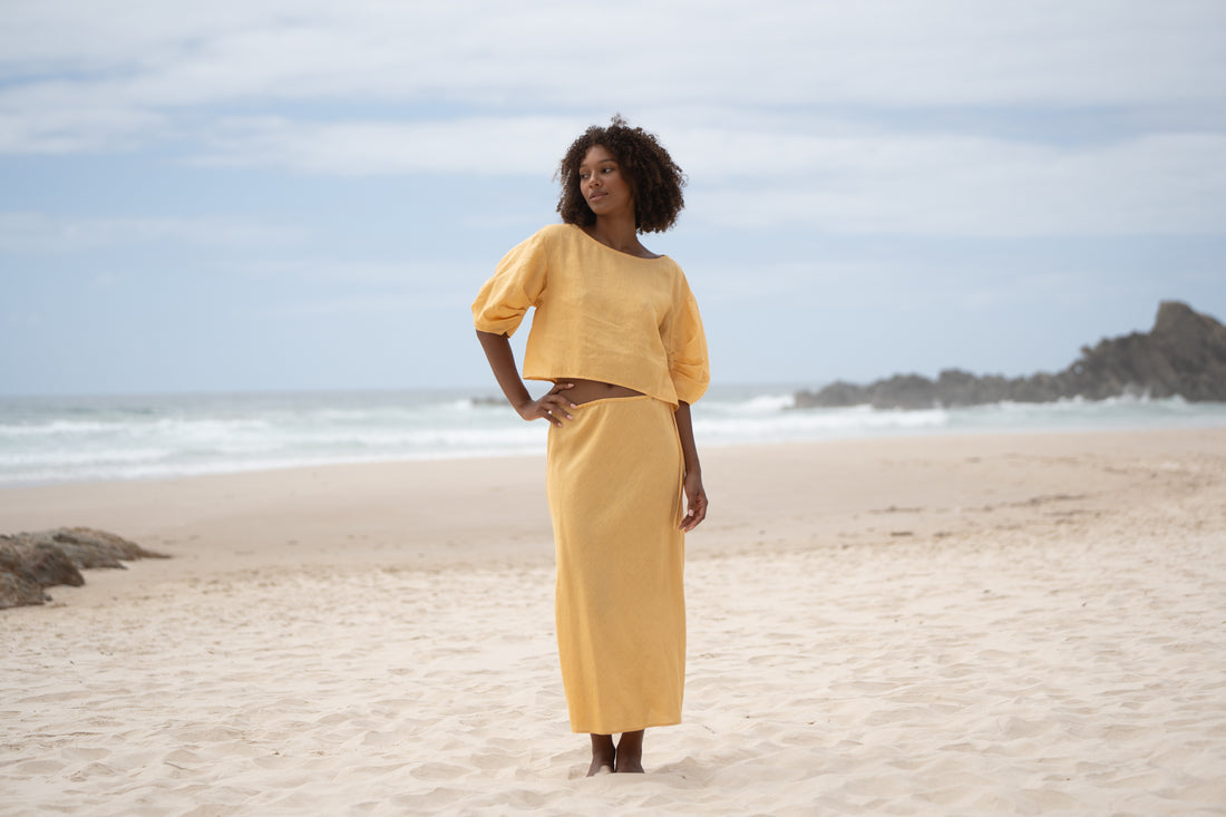 LILLY PILLY Collection model wearing Stella linen skirt in Tea paired with Tina linen top in Ivory