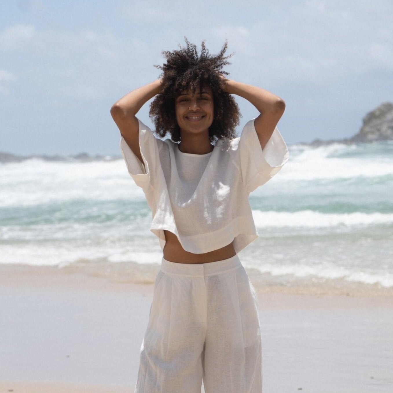 LILLY PILLY model wears Maya linen top paired with Oli pants in Ivory