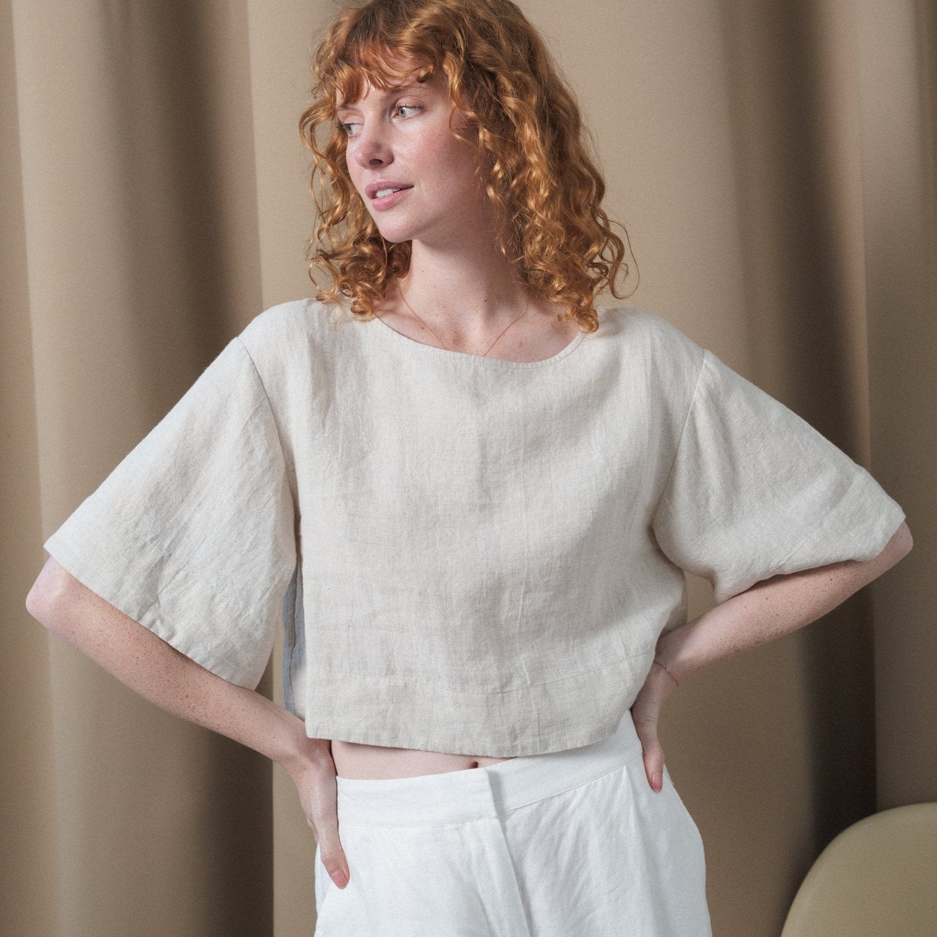 LILLY PILLY model wears Maya linen top in Oatmeal paired with Oli pants in Ivory